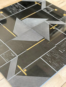 Continuous sheets of Geo Deco black marble and brass tile