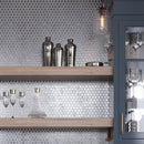 Silver Cocktail Shakers On A Shelf Against A Glossy Silver Hexagon Glass Mosaic Wall Background