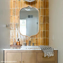 Handmade subway tile bathroom backsplash with a mid-century modern vanity