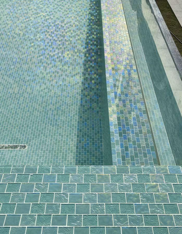 Blue green iridescent brick subway pool tile